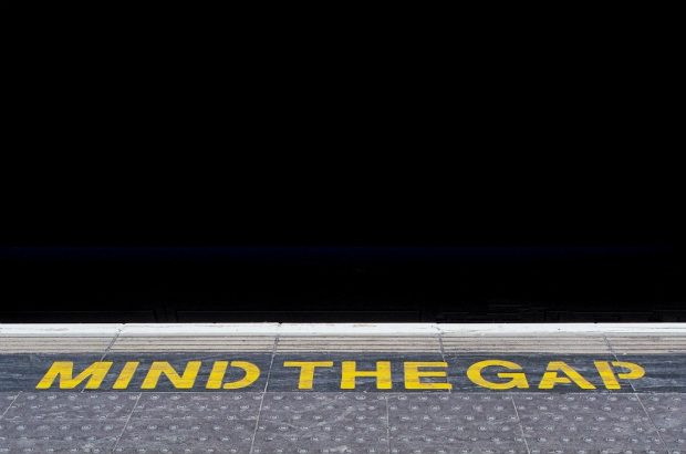 Image of London tube platform with the words, "mind the gap".