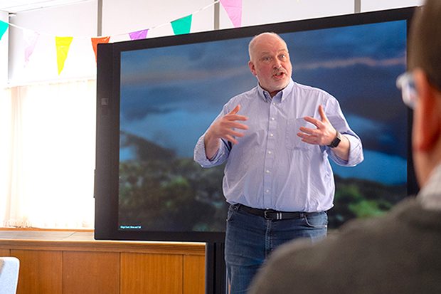 Simon McKinnon addresses colleagues during a stand-up at DWP Digital