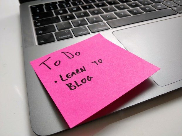 Sticky note reading "To Do - Learn To Blog"