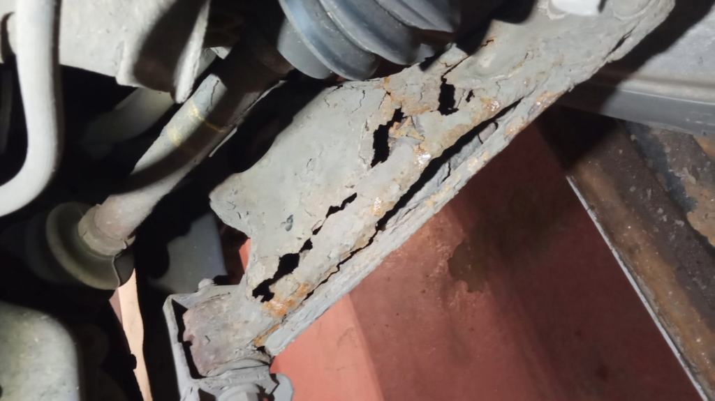 Severely corroded lower suspension arm
