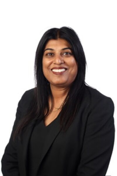 A woman smiling into the camera