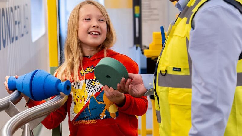 Girl and volunteer on board Inspiration train