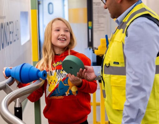 Girl and volunteer on board Inspiration train