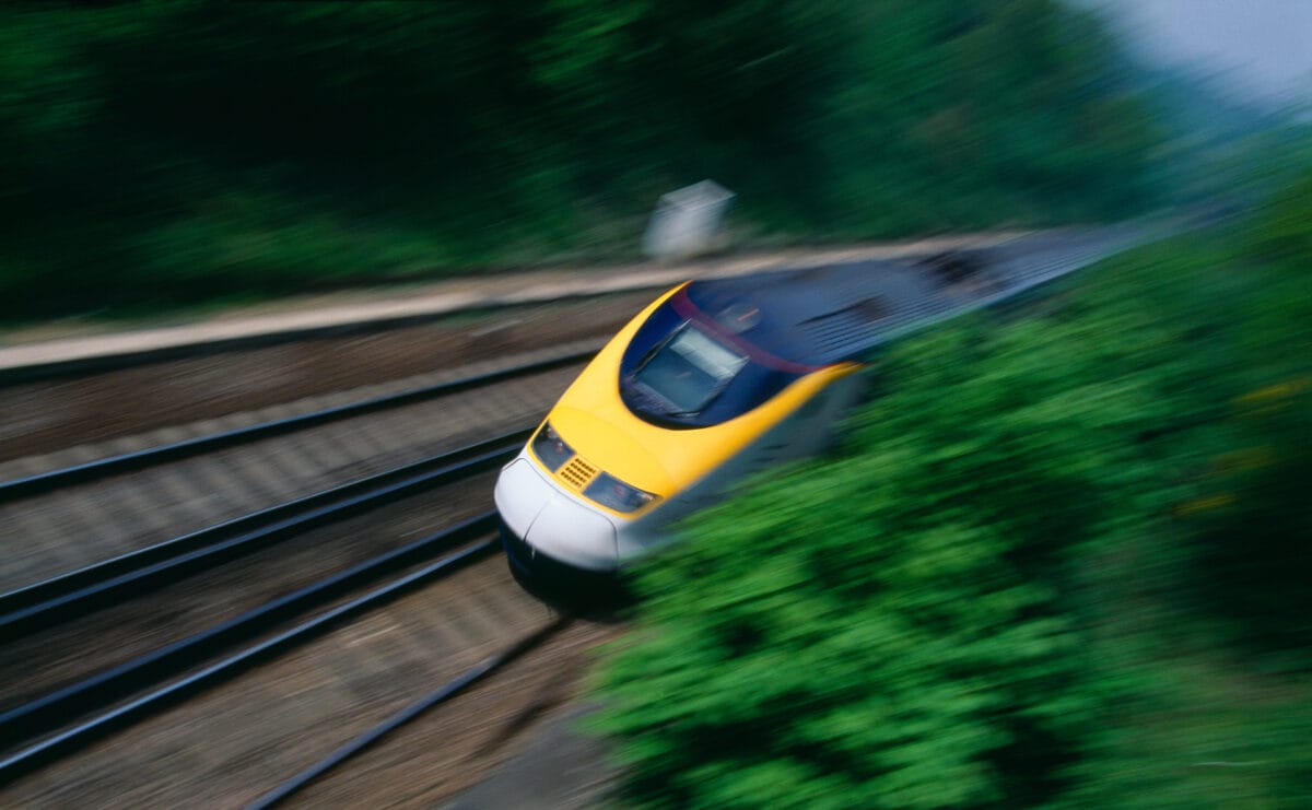 A Eurostar train on a track travelling through the countryside