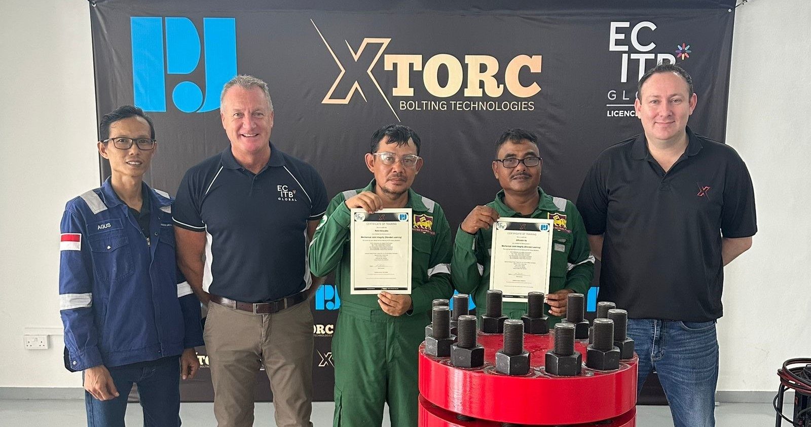 ECITB Global's Jason Riley, Second Left, At XTorc In Indonesia To See The MJI Blended Learning Course