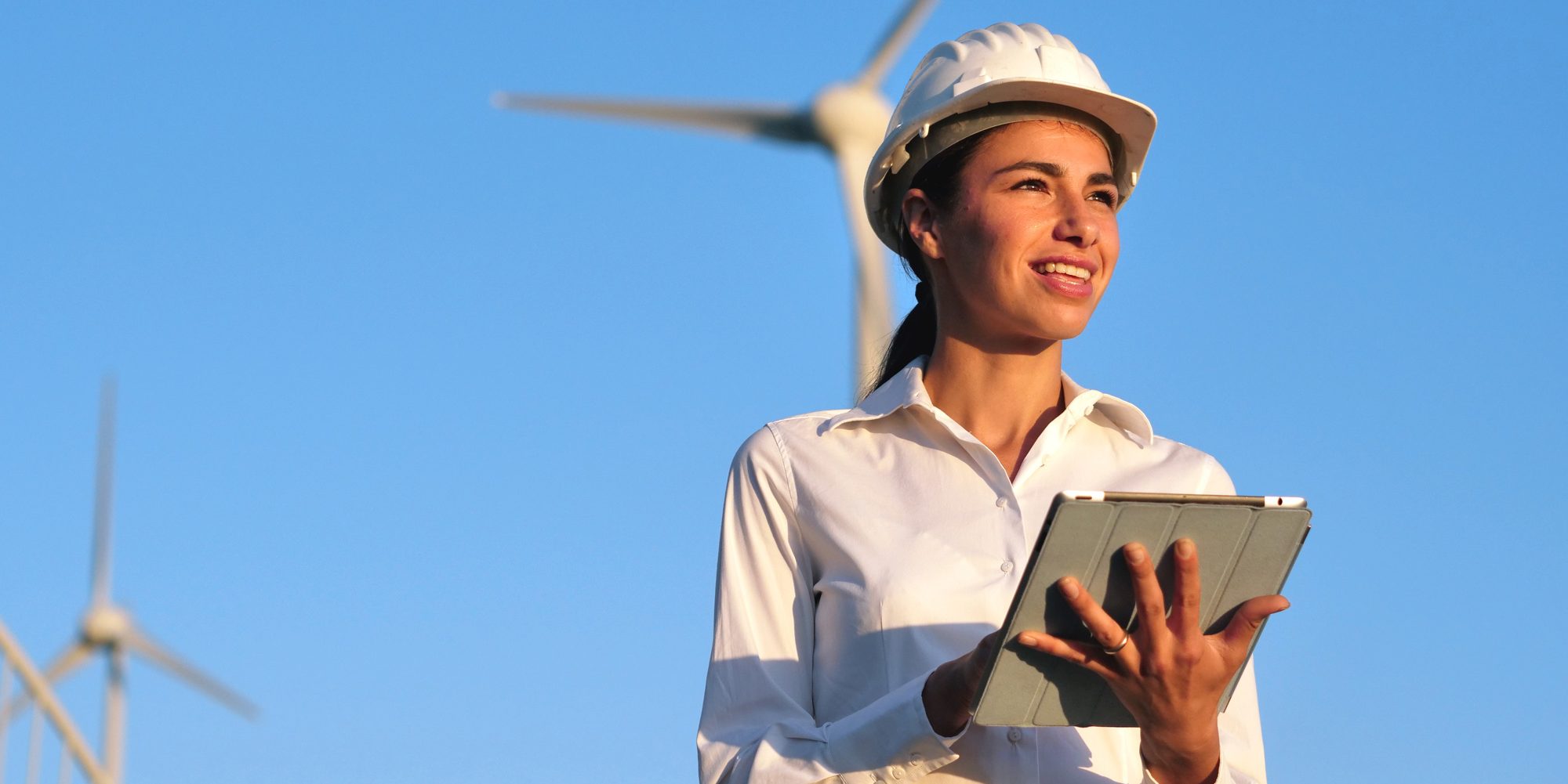 Woman engineer with wind turbine