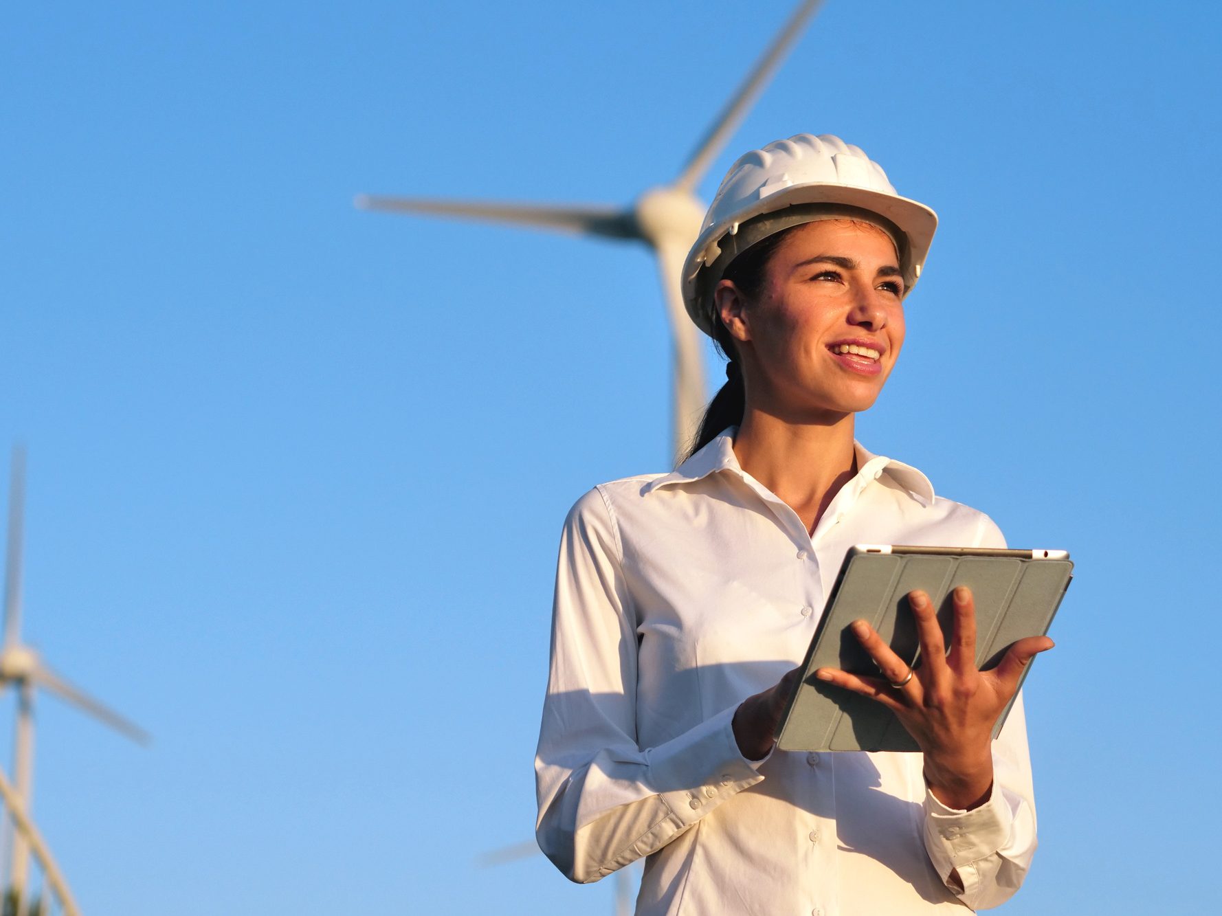 Woman engineer with wind turbine