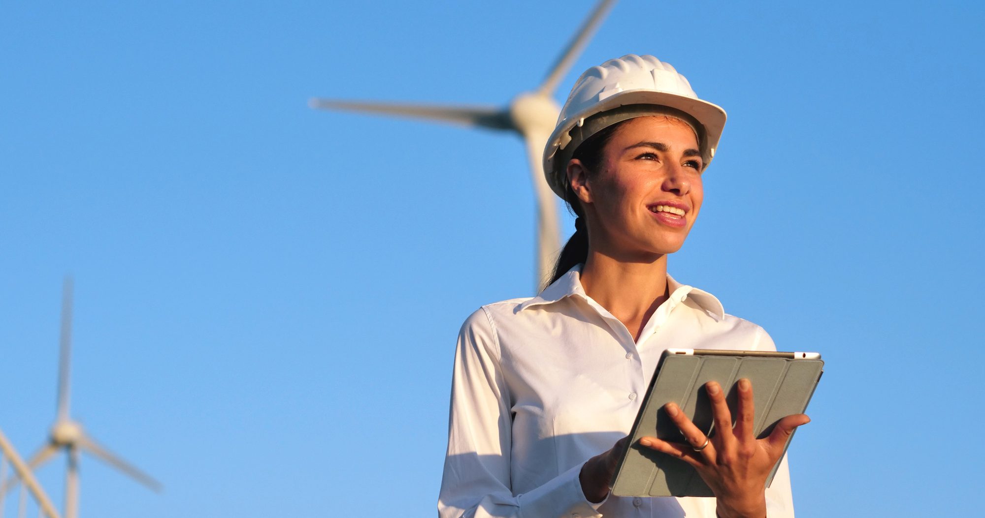 Woman engineer with wind turbine