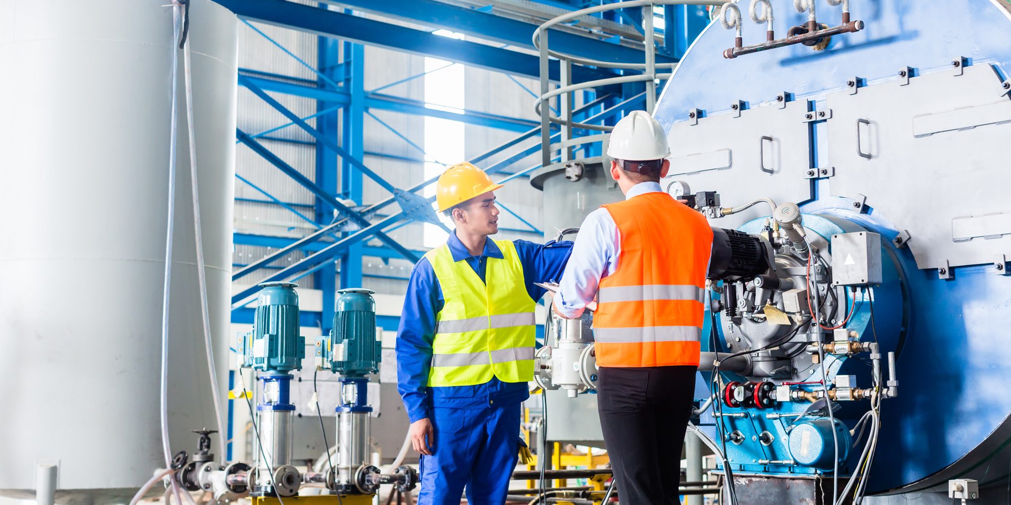 Worker And Manager at Industrial site