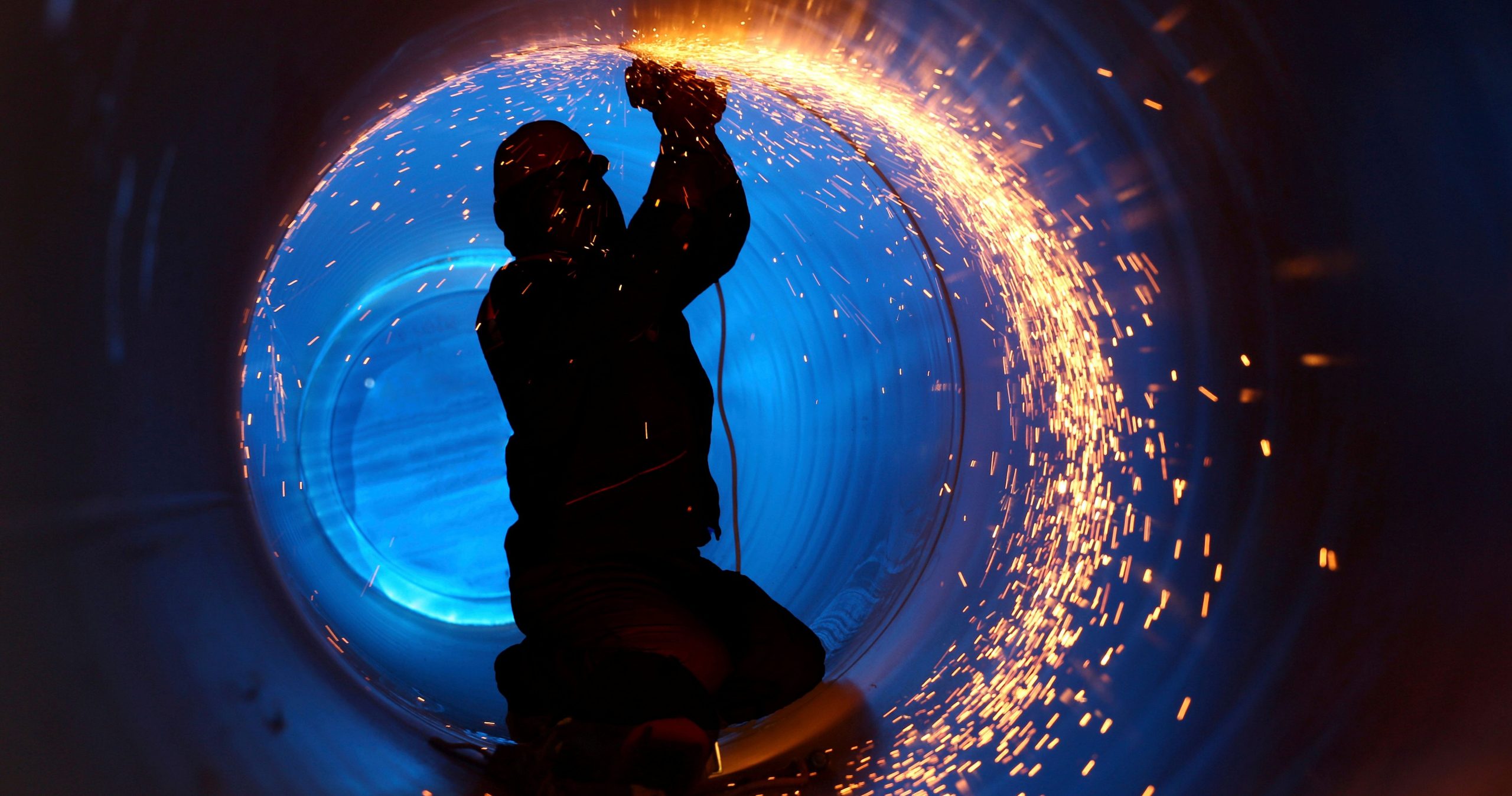 Confined Space Operations Showing A Worker Inside A Pipe On A Pipeline Construction