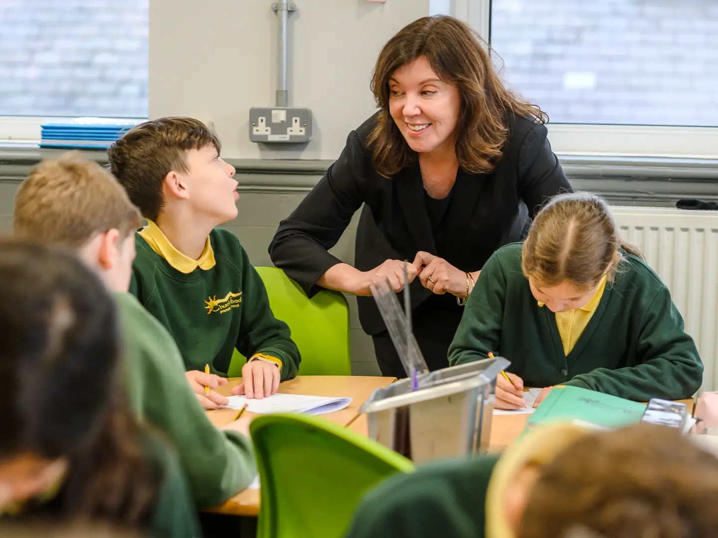 Dame Rachel de Souza engaging with school children