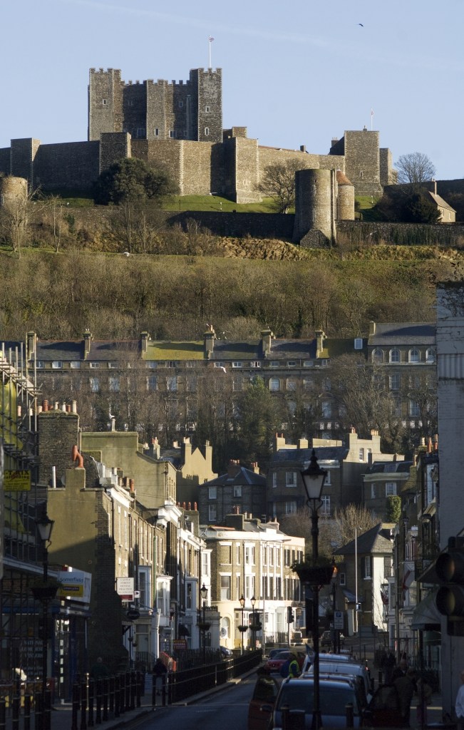 A view of Dover Castle on top of the hill, with the town below.