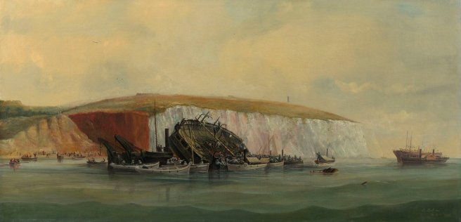 Oil painting of wrecked ship laid up against white cliffs, with boats surrounding her on a slightly swelling sea, a cloudy sky above.