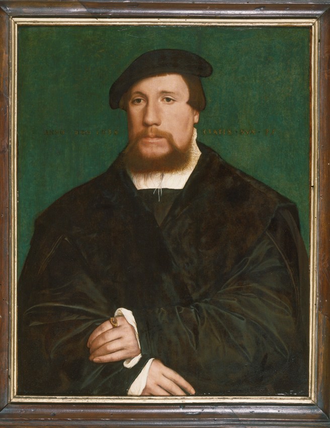 Bust-length portrait of a bearded man dressed in black, with white collar and cuffs, facing left, with his hands crossed in the lower register of the image. He is set against a dark green background.
