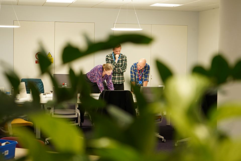 A trio of civil servants at a sprint event.