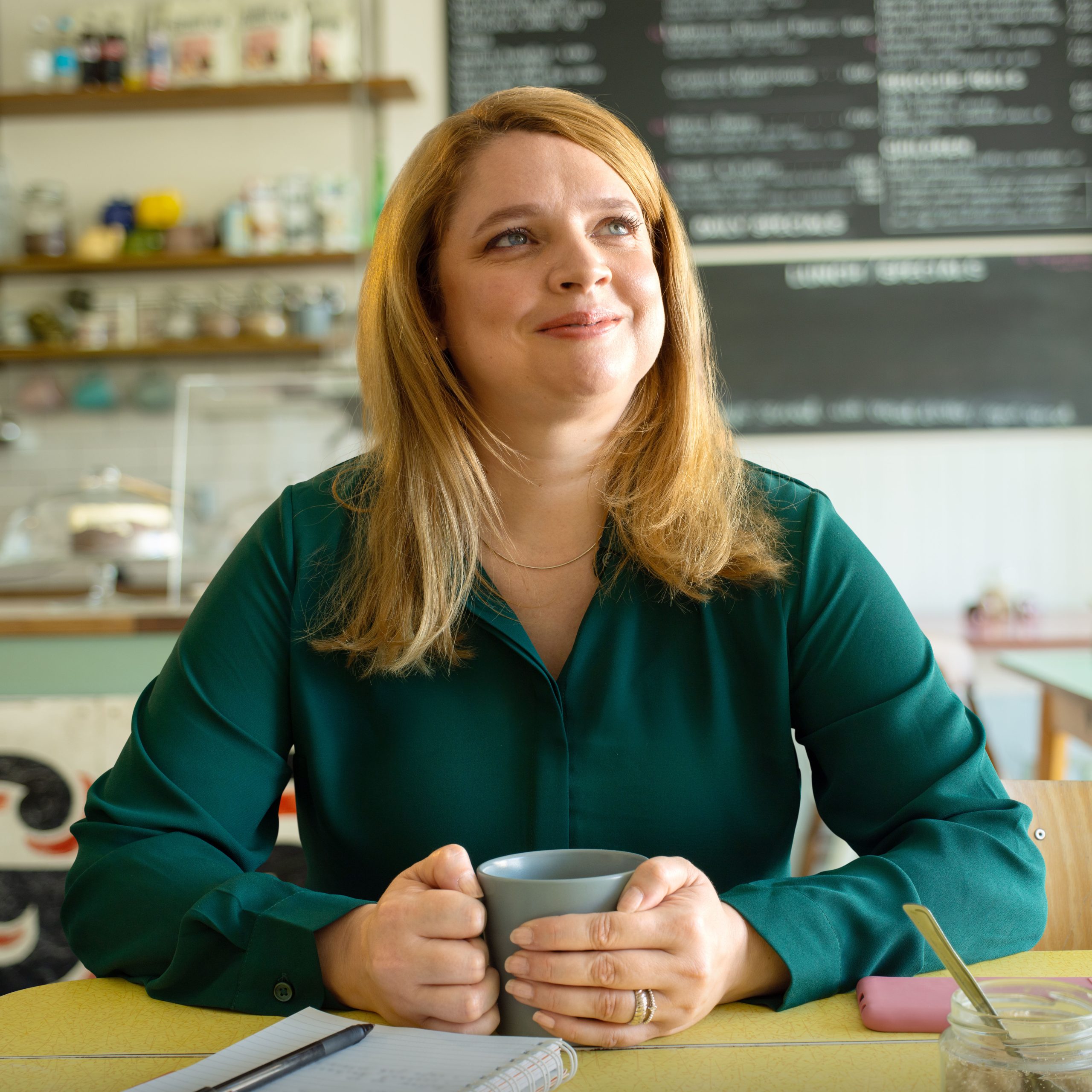 Smiling woman sitting in cafe