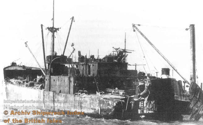 Historical photograph of the SS Mount Othrys, a damaged cargo vessel, highlighting its collapsed structure due to the aftermath of a collision.