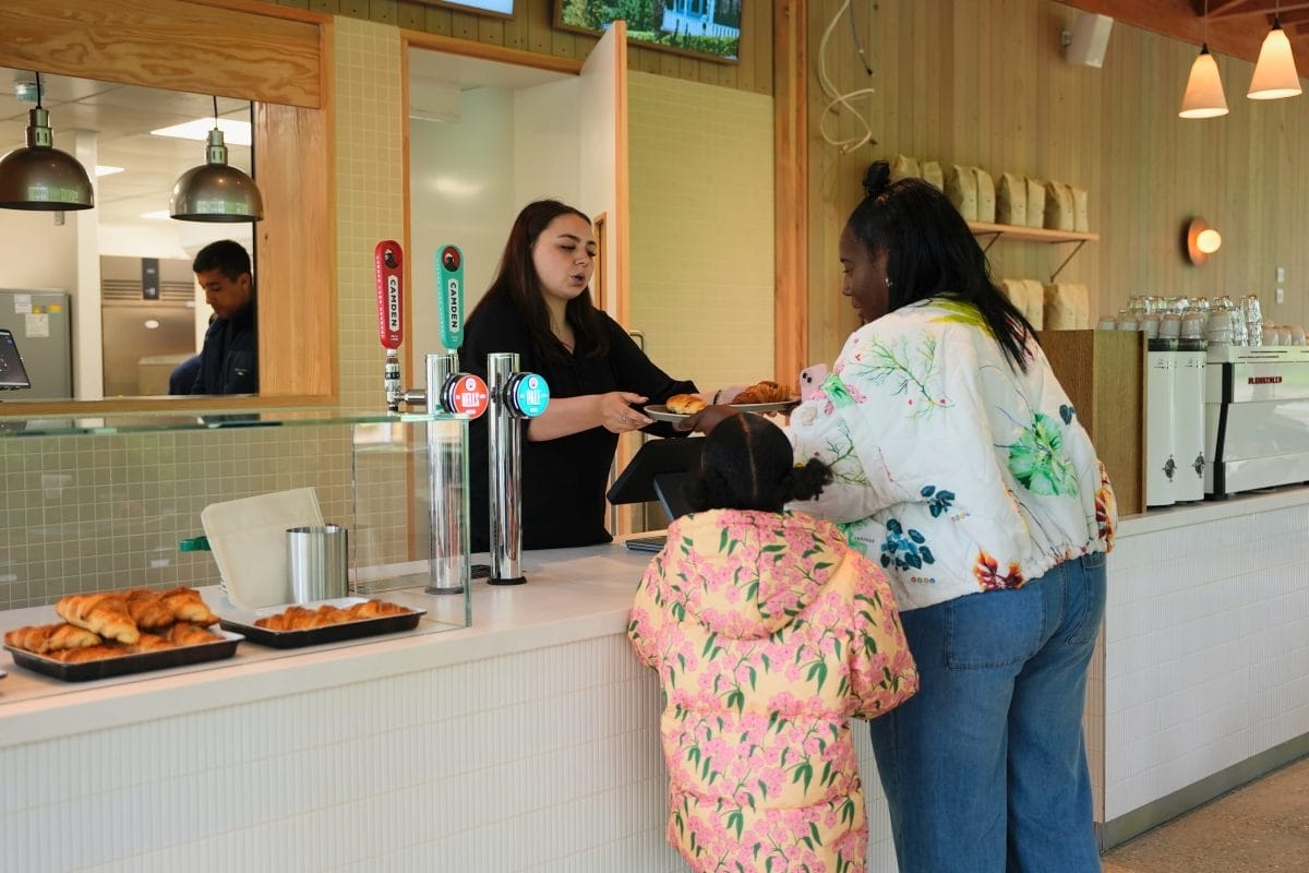 Image of mother and child in pink coat ordered at the Kuseuma Nature cafe.