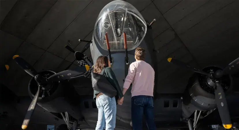 Visitors looking up at a B-17 Flying Fortress in the American Air Museum