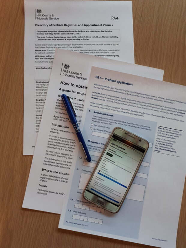 probate forms and phone on desk