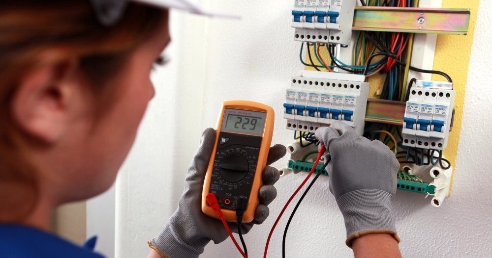 Woman Undertaking Electrical Testing