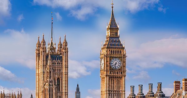 Big Ben And Houses Of Parliament With Boats On The River In Lond