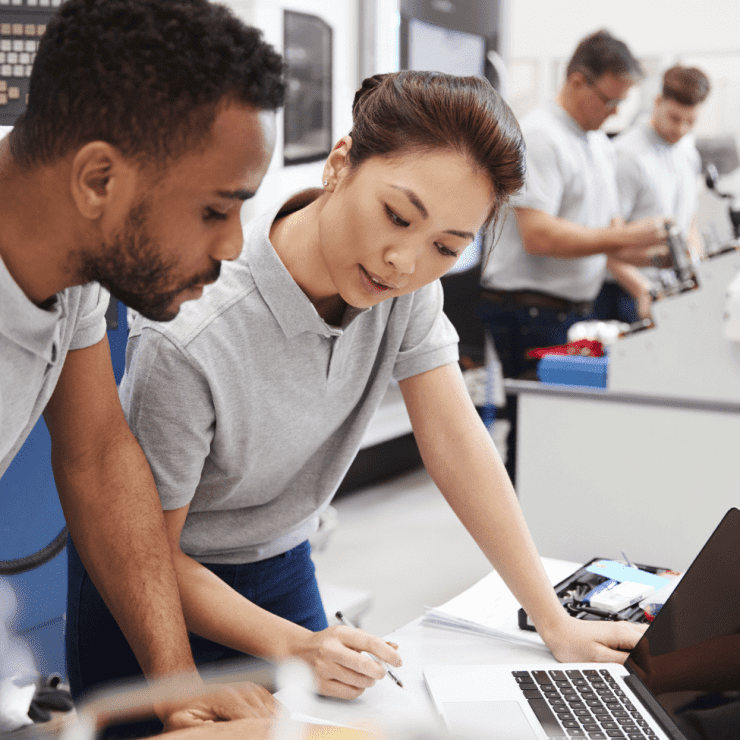 Woman And Man Looking At Laptop