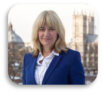Image of a woman smiling at the camera against a backdrop of London