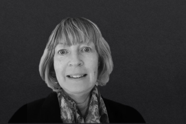 Black and white portrait of a female smiling at camera