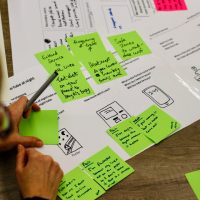 Post its on Top of Service 'tube journey at night' with person looking at them