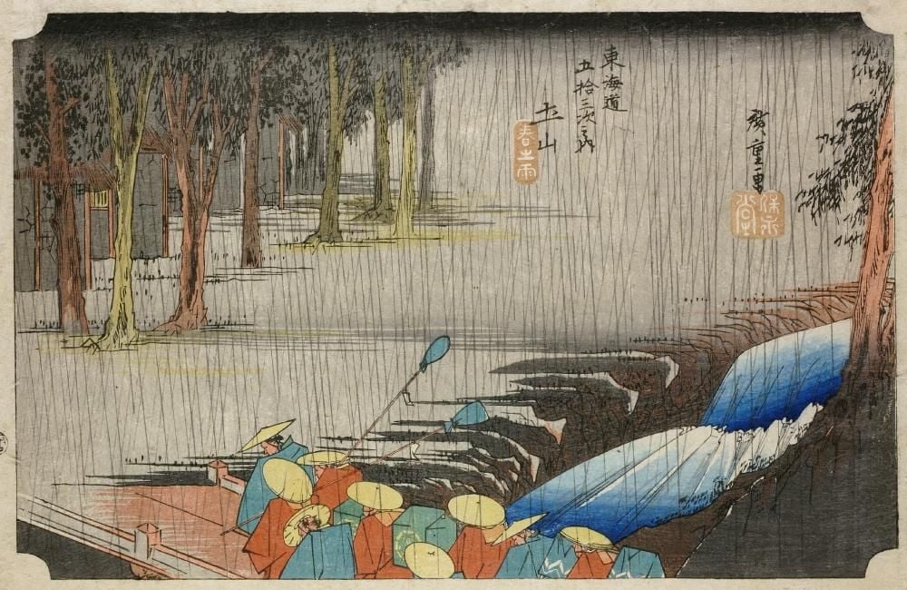 Woodblock print showing a daimyo's procession crossing bridge over rushing stream.