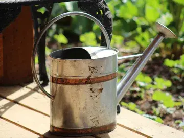 A metal watering can