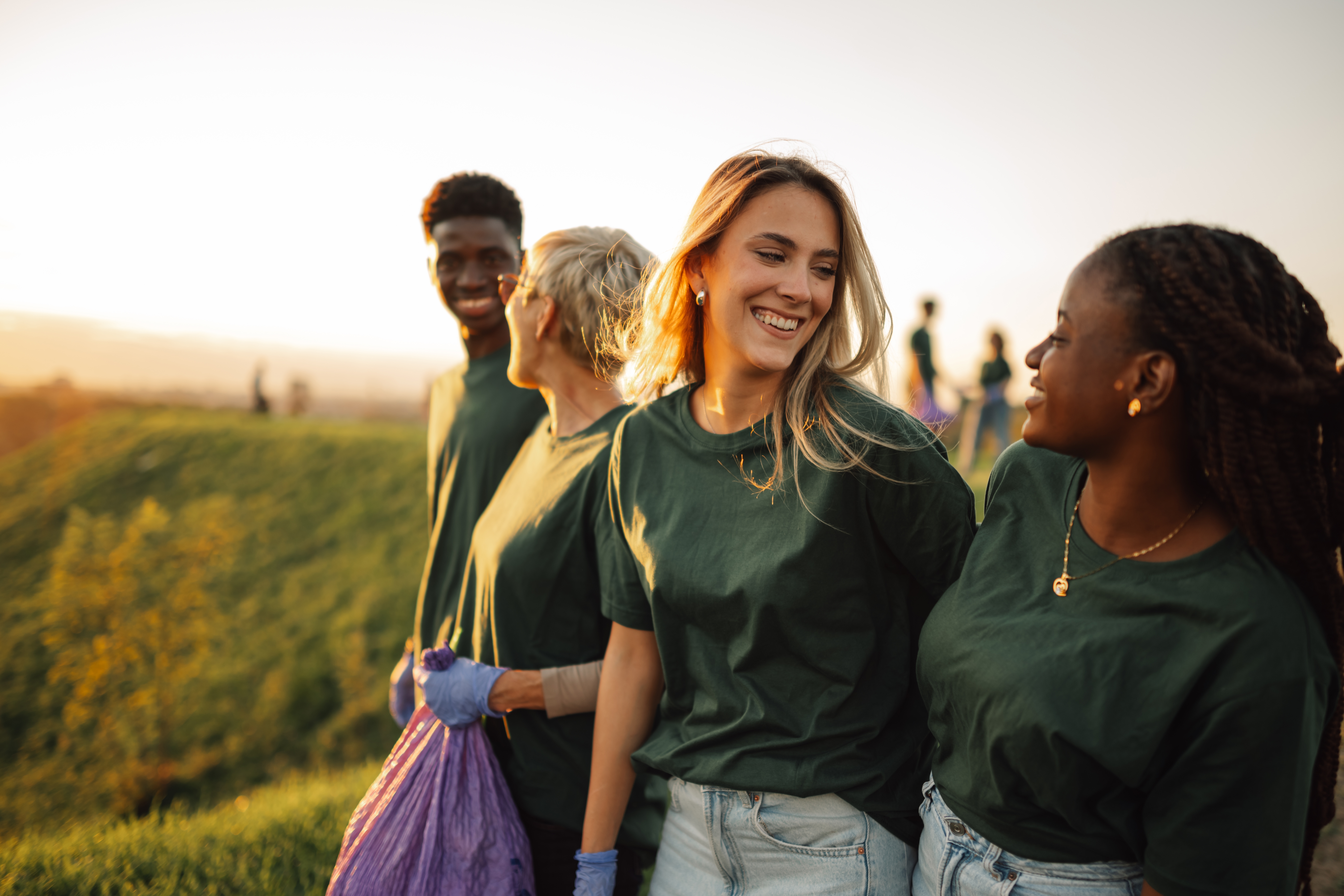 Four young people doing voluntary work in the countryside