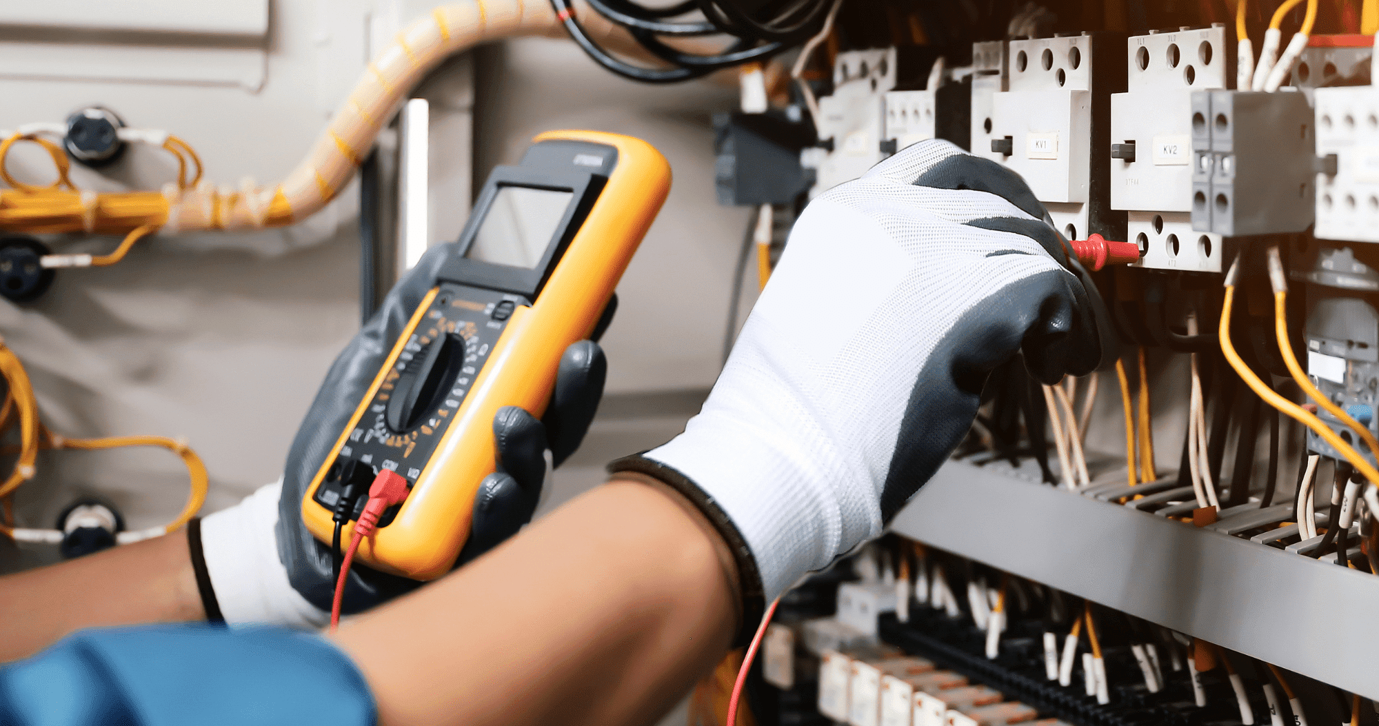 Electrical Person Wearing Safety Gloves Testing Wires