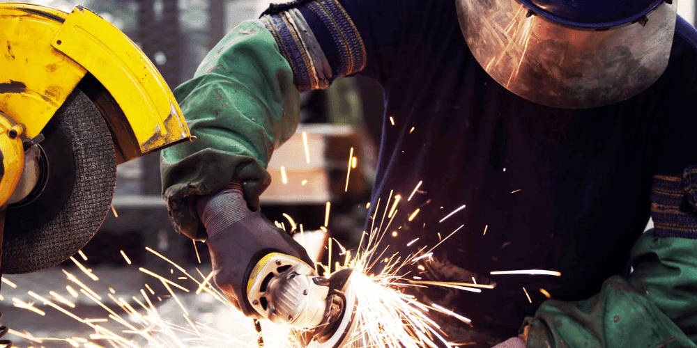Man In PPE Working With Abrasive Wheels - find engineering training courses and ECITB courses in trade disciplines plus technical tests