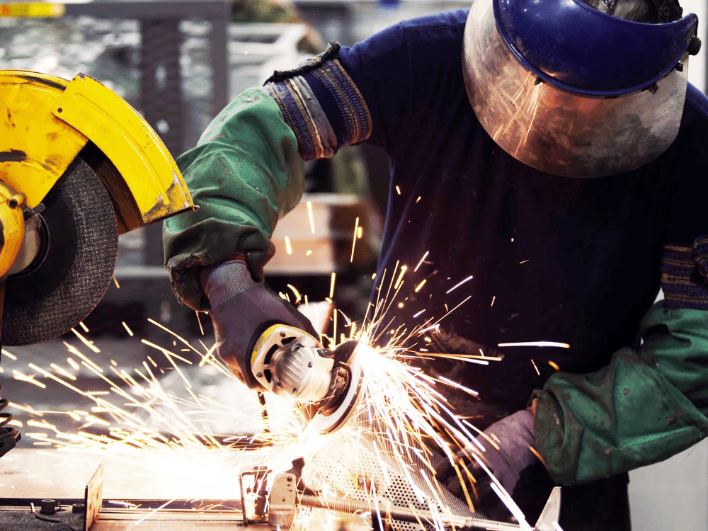 Man In PPE Working With Abrasive Wheels - find engineering training courses and ECITB courses in trade disciplines plus technical tests
