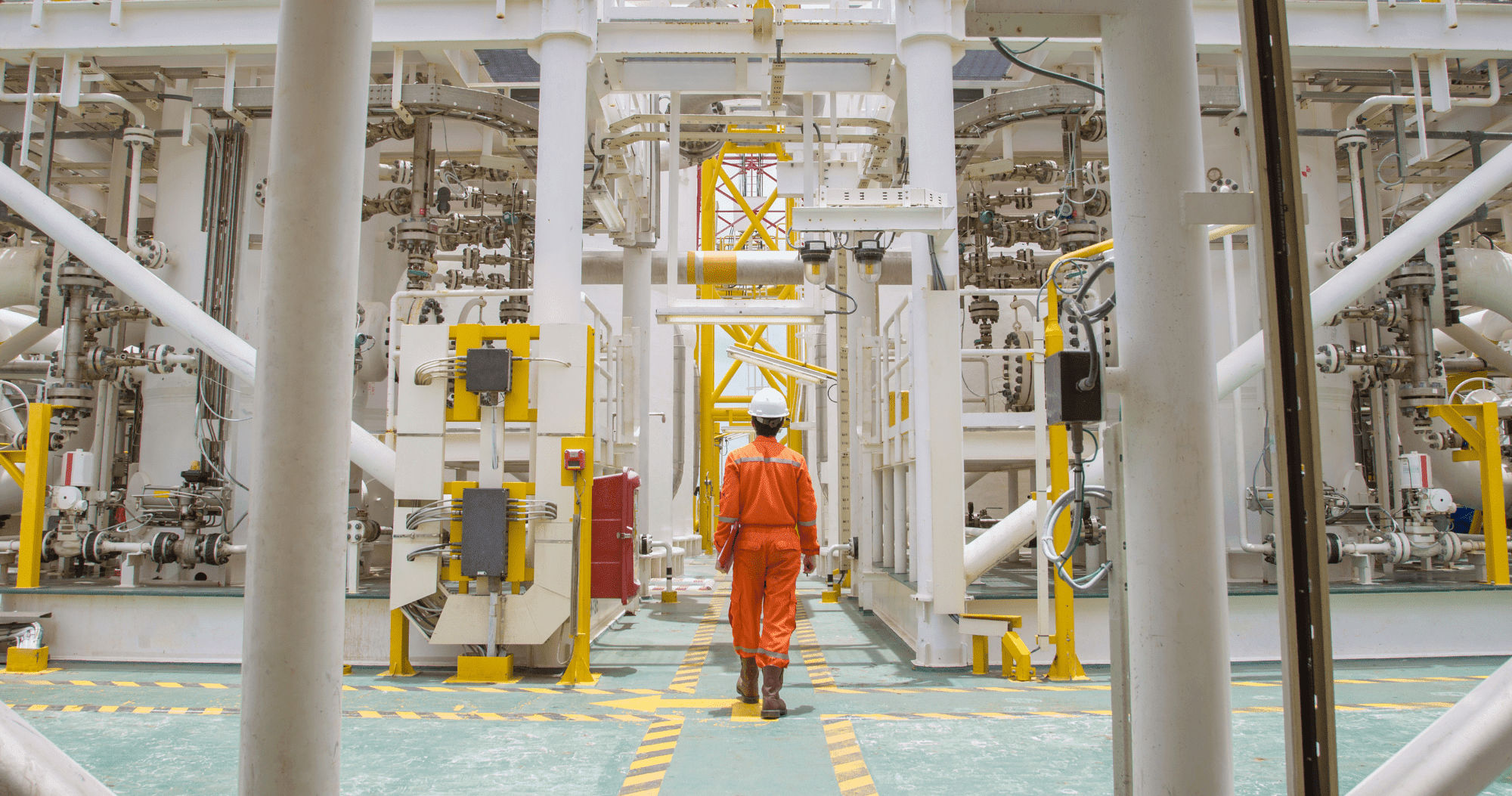 Site Operations Man Dressed In Orange Standing On Oil Rig