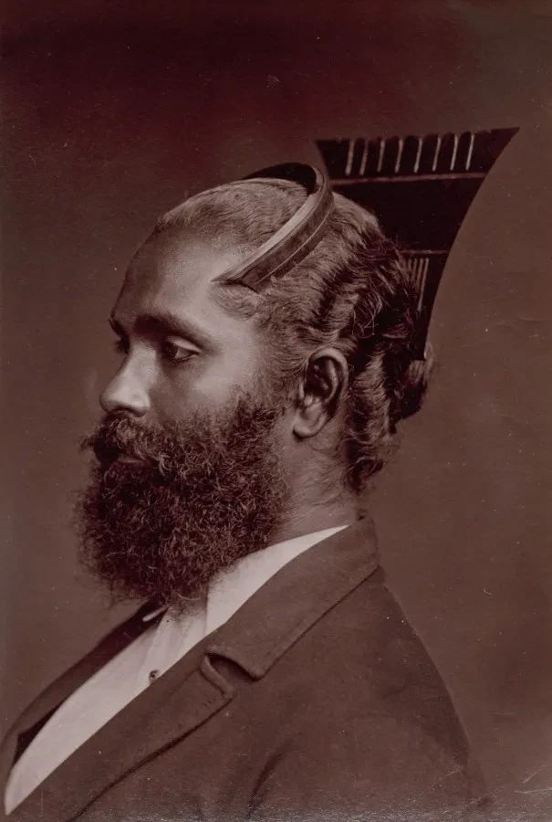 A historic photograph of a man in side profile