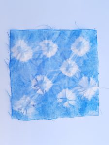 Square fabric died blue with white pattern