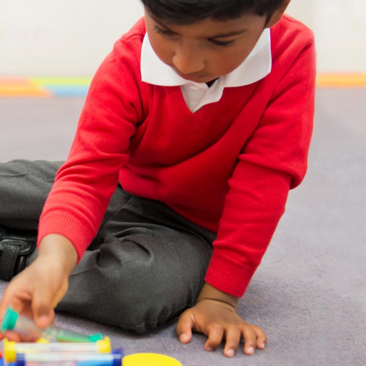 Student using shapes for maths