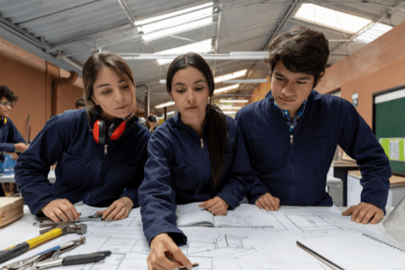 Three students designing and draughting