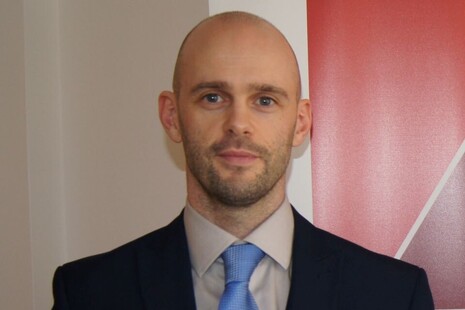 A photograph of Owen McCloskey, member of the Social Security Advisory Committee.