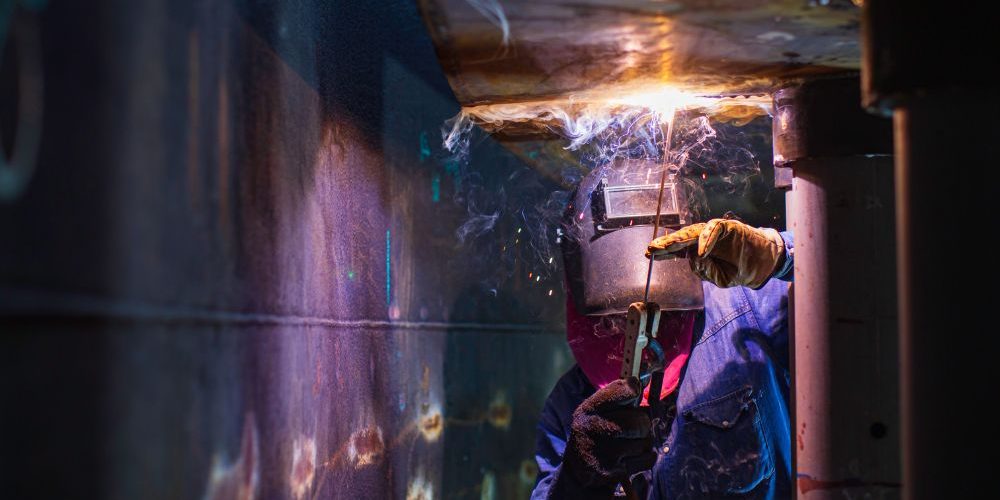 Welder Working In Confined Space