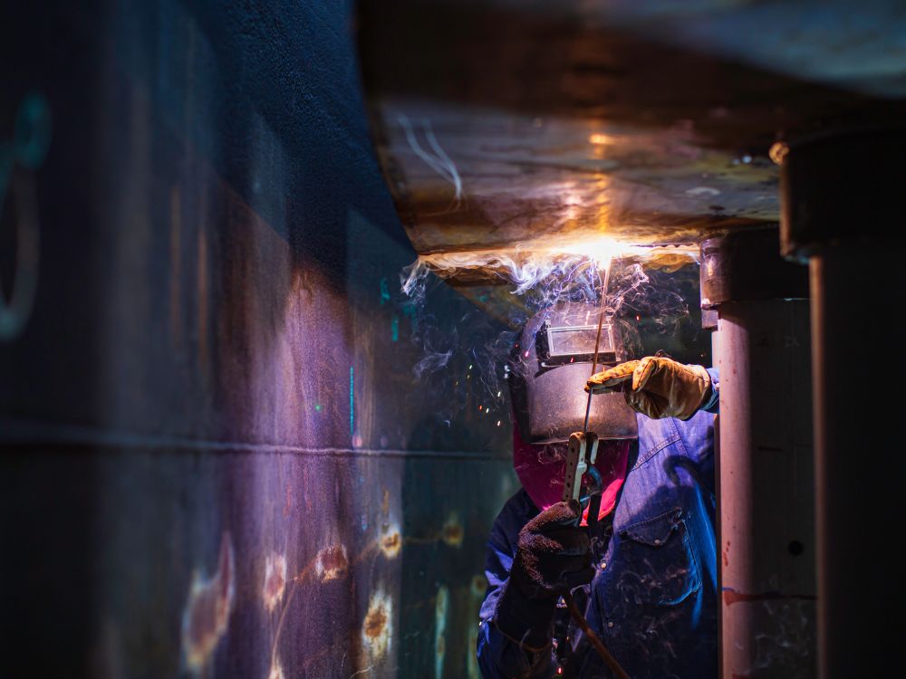 Welder Working In Confined Space