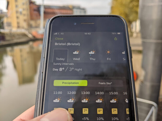 Met Office weather forecast for Bristol on a phone, being used outdoors in dark mode