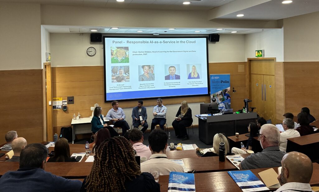 Image of a panel discussion during the event, photo taken from back of the lecture theatre