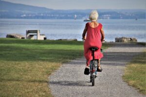 Retired woman enjoying a bike ride