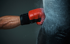 Boxer punching a punching bag