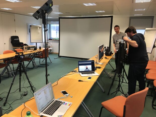 Graham and Mark setting up the smartphone in front of a monitor