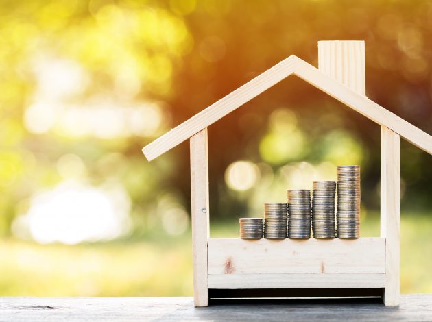 Image of house with money piles in it